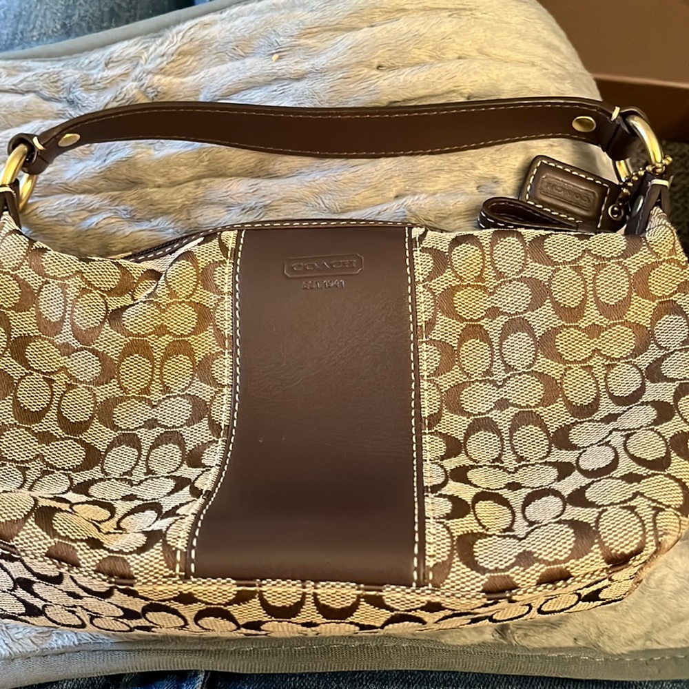 Coach small purse slips over your hand. Authentic.